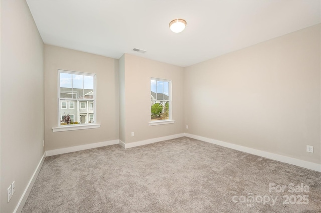 2332 Paddlers Cove Dr, Lake Wylie, SC 29710 - empty room featuring a healthy amount of sunlight, carpet flooring, and baseboards