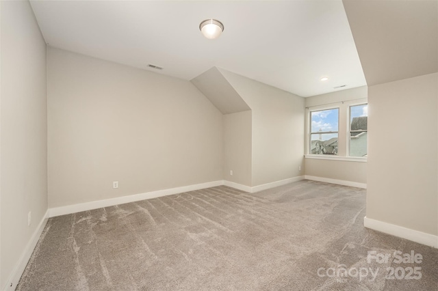 2332 Paddlers Cove Dr, Lake Wylie, SC 29710 - additional living space featuring carpet floors, baseboards, visible vents, and lofted ceiling