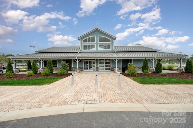 2332 Paddlers Cove Dr, Lake Wylie, SC 29710 - farmhouse-style home featuring a standing seam roof, metal roof, stone siding, and covered porch