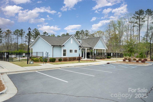 2332 Paddlers Cove Dr, Lake Wylie, SC 29710 - view of building exterior with fence and uncovered parking
