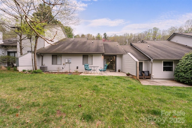 407 Sweeten Way, Asheville, NC 28803 - rear view of property featuring a lawn, central air condition unit, roof with shingles, and a patio area