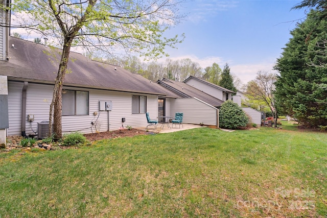 407 Sweeten Way, Asheville, NC 28803 - back of house with a patio, a shingled roof, central air condition unit, and a lawn