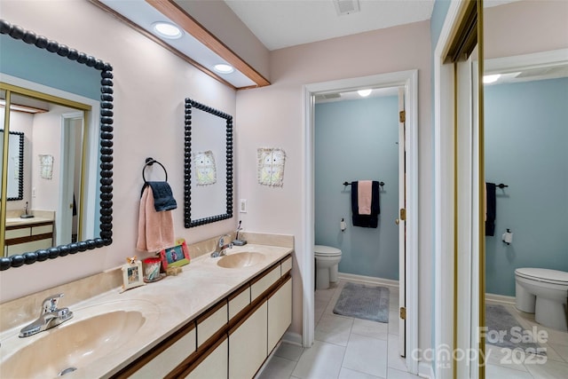 407 Sweeten Way, Asheville, NC 28803 - full bath with double vanity, a sink, toilet, and tile patterned flooring