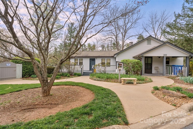 407 Sweeten Way, Asheville, NC 28803 - view of front facade featuring a chimney and covered porch
