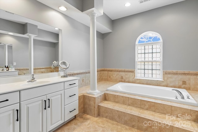 full bath with a bath, decorative columns, recessed lighting, vanity, and tile patterned flooring