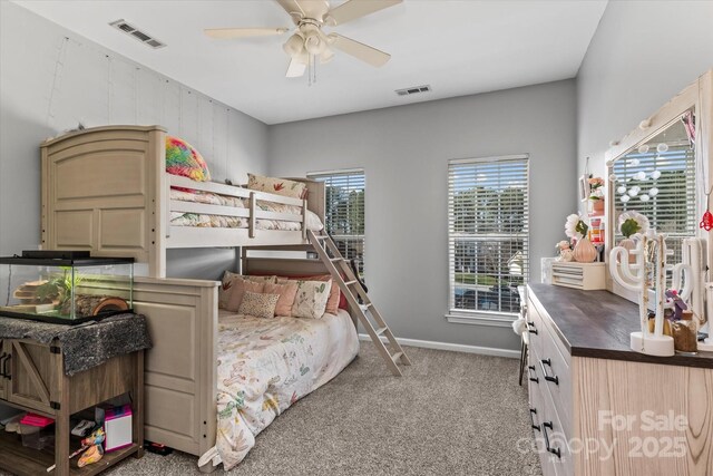 bedroom with carpet, visible vents, and baseboards
