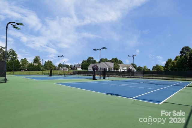 view of sport court with fence