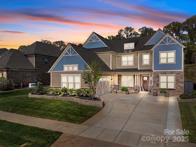 10904 Kilkenny Dr, Matthews, NC 28105 - view of front of house featuring driveway, stone siding, and a front lawn