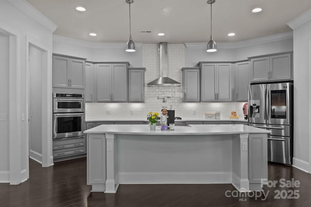 10904 Kilkenny Dr, Matthews, NC 28105 - kitchen featuring stainless steel appliances, gray cabinets, wall chimney range hood, light countertops, and crown molding