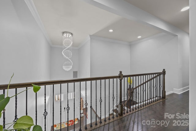 10904 Kilkenny Dr, Matthews, NC 28105 - hallway with ornamental molding, a chandelier, wood finished floors, an upstairs landing, and recessed lighting