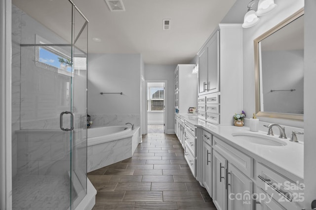 10904 Kilkenny Dr, Matthews, NC 28105 - full bathroom featuring double vanity, a bath, and a stall shower