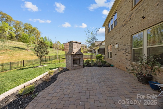 10904 Kilkenny Dr, Matthews, NC 28105 - fenced backyard featuring a fireplace and a patio