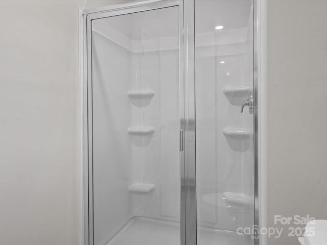 bathroom with a stall shower
