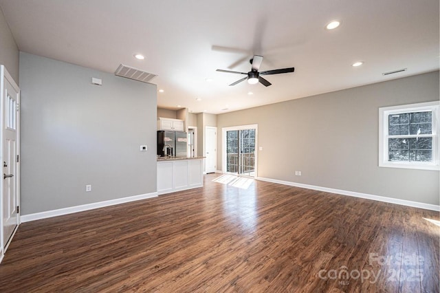 1314 39th Street Cir SW, Hickory, NC 28602 - unfurnished living room with baseboards, visible vents, dark wood-type flooring, and a ceiling fan