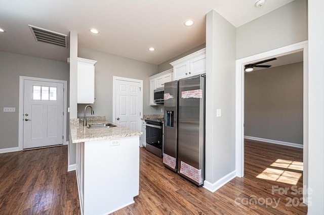 1314 39th Street Cir SW, Hickory, NC 28602 - kitchen with a sink, dark wood-style floors, visible vents, white cabinets, and appliances with stainless steel finishes