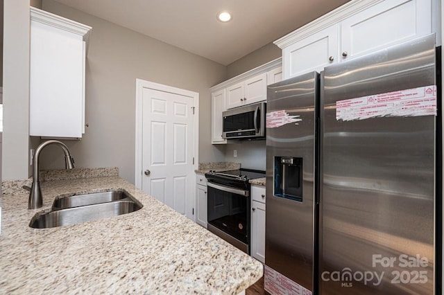 1314 39th Street Cir SW, Hickory, NC 28602 - kitchen with recessed lighting, stainless steel appliances, a sink, white cabinets, and light stone countertops