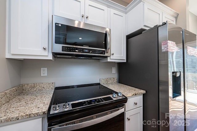 1314 39th Street Cir SW, Hickory, NC 28602 - kitchen featuring white cabinets, stainless steel appliances, and light stone counters