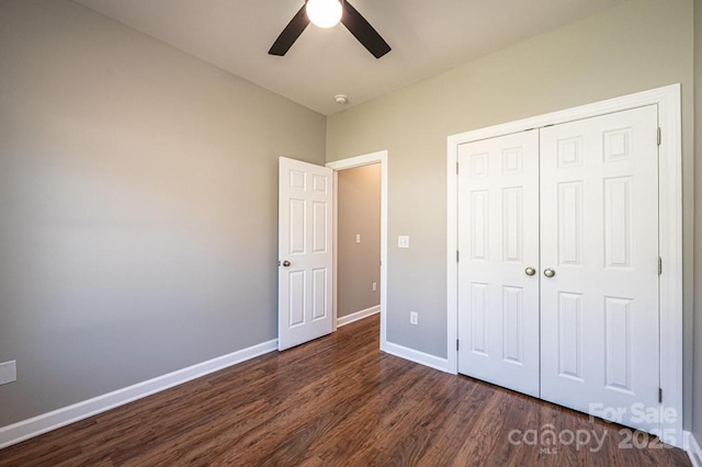 1314 39th Street Cir SW, Hickory, NC 28602 - unfurnished bedroom featuring baseboards, ceiling fan, a closet, and dark wood finished floors
