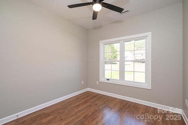 1314 39th Street Cir SW, Hickory, NC 28602 - spare room with baseboards, visible vents, a ceiling fan, and dark wood finished floors