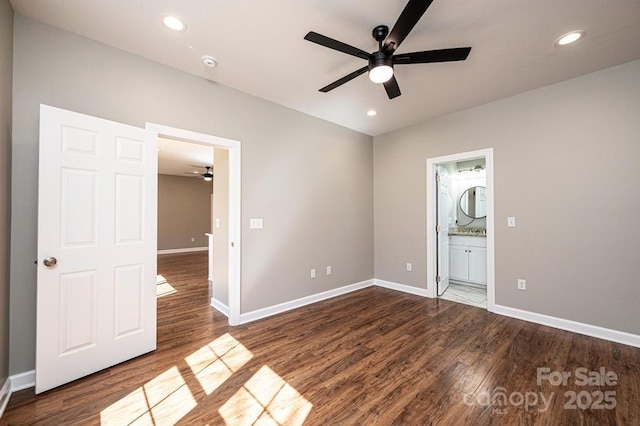 1314 39th Street Cir SW, Hickory, NC 28602 - unfurnished bedroom with connected bathroom, dark wood-type flooring, baseboards, and recessed lighting
