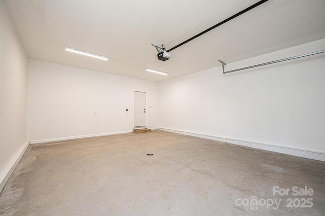 1314 39th Street Cir SW, Hickory, NC 28602 - garage with baseboards and a garage door opener