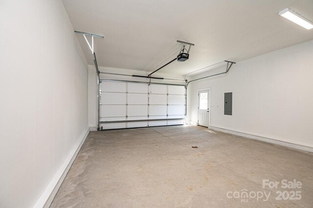 1314 39th Street Cir SW, Hickory, NC 28602 - garage featuring electric panel and a garage door opener