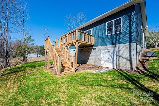 1314 39th Street Cir SW, Hickory, NC 28602 - back of property with a wooden deck, stairway, and a yard