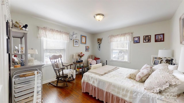608 Forney Ave, Lincolnton, NC 28092 - bedroom featuring dark wood-style flooring and multiple windows
