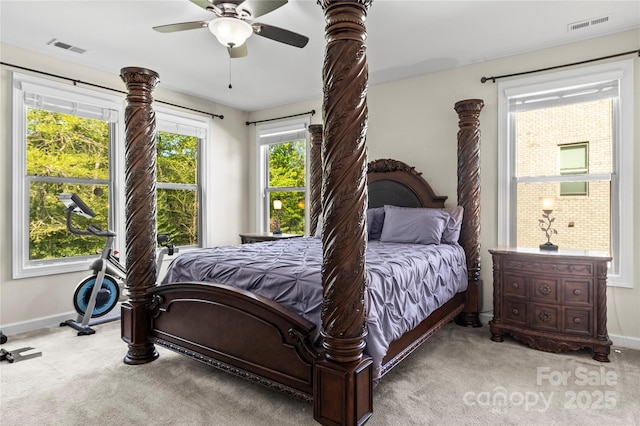 carpeted bedroom featuring baseboards and ceiling fan