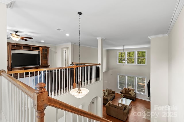 corridor featuring wood finished floors, recessed lighting, crown molding, an upstairs landing, and baseboards