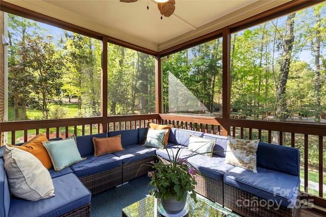 sunroom featuring an outdoor living space, ceiling fan, and plenty of natural light