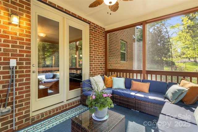 sunroom featuring an outdoor living space, ceiling fan, and plenty of natural light