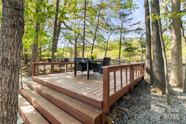 wooden terrace with outdoor dining space