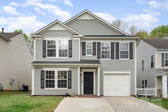 2005 Dunsmore Ln, Waxhaw, NC 28173 - traditional home featuring central AC unit, driveway, and an attached garage