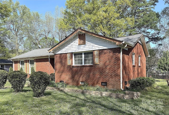 3220 Wiseman Dr, Charlotte, NC 28227 - view of side of home with a lawn, fence, and brick siding