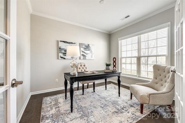 office area with baseboards, visible vents, crown molding, and wood finished floors