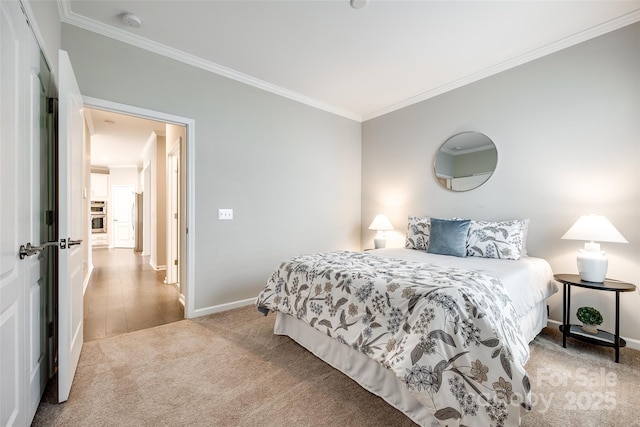 carpeted bedroom with baseboards and crown molding