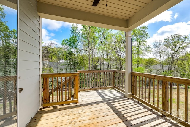 wooden terrace with a ceiling fan