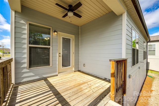 wooden deck with ceiling fan