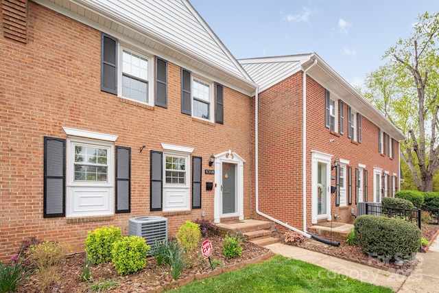 8308 Knights Bridge Rd, Charlotte, NC 28210 - view of front of property with central AC and brick siding