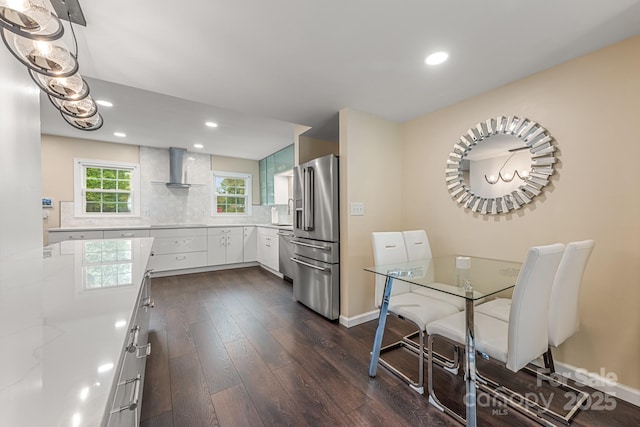 8308 Knights Bridge Rd, Charlotte, NC 28210 - kitchen with dark wood-type flooring, wall chimney exhaust hood, appliances with stainless steel finishes, and recessed lighting