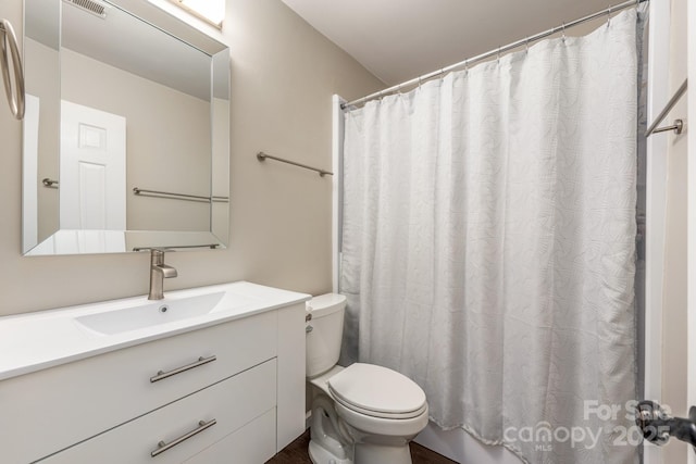 8308 Knights Bridge Rd, Charlotte, NC 28210 - bathroom with a shower with shower curtain, visible vents, toilet, and vanity