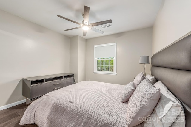 8308 Knights Bridge Rd, Charlotte, NC 28210 - bedroom featuring dark wood-type flooring, visible vents, a ceiling fan, and baseboards