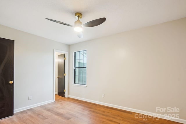 unfurnished bedroom with light wood finished floors, baseboards, and a ceiling fan