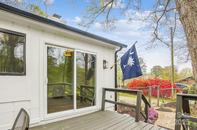 deck featuring a gate and fence