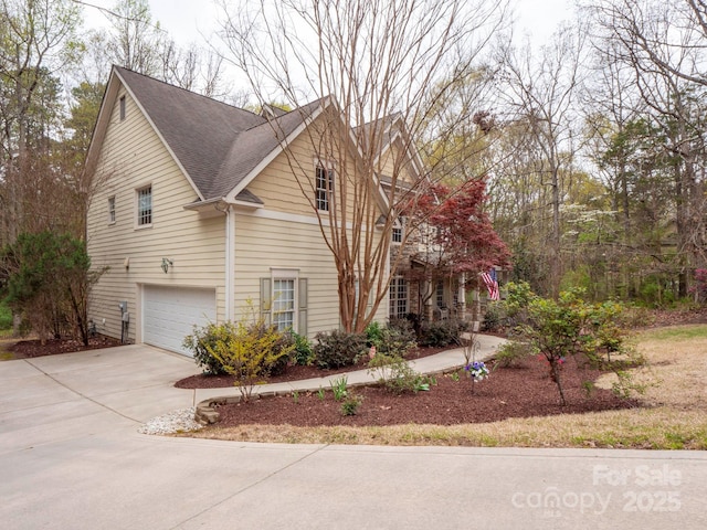6108 Mcilwaine Rd, Huntersville, NC 28078 - view of property exterior with a garage, driveway, and roof with shingles