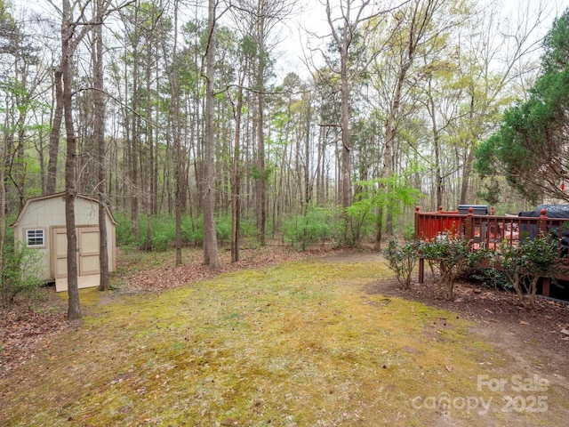 6108 Mcilwaine Rd, Huntersville, NC 28078 - view of yard with an outdoor structure, a deck, and a storage shed