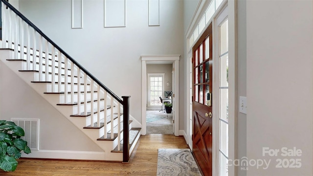 6108 Mcilwaine Rd, Huntersville, NC 28078 - entryway featuring baseboards, wood finished floors, visible vents, and stairway