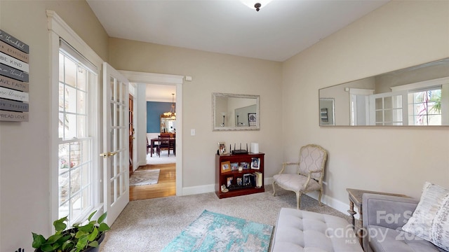 6108 Mcilwaine Rd, Huntersville, NC 28078 - sitting room featuring baseboards, carpet floors, and an inviting chandelier