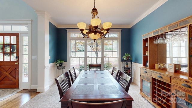 6108 Mcilwaine Rd, Huntersville, NC 28078 - dining area featuring wood finished floors, a notable chandelier, and ornamental molding